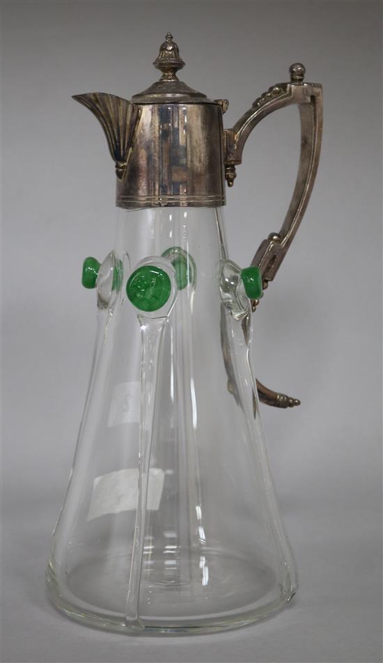 An Art Nouveau glass claret jug with plated mount